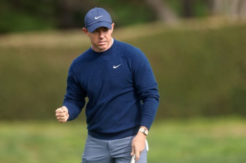 Third-ranked Rory McIlroy of Northern Ireland celebrates sinking an eagle putt at the 14th