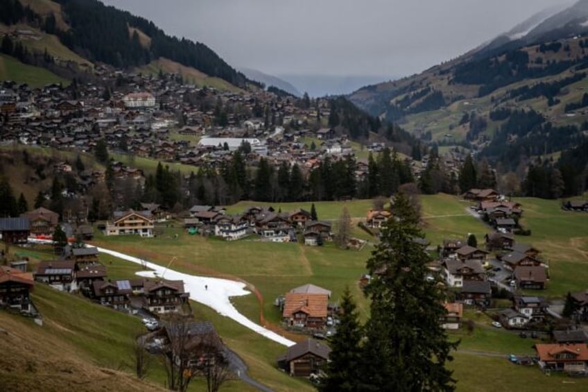 A slope amid a near-snowless landscape during the FIS Alpine ski World Cup events in the S