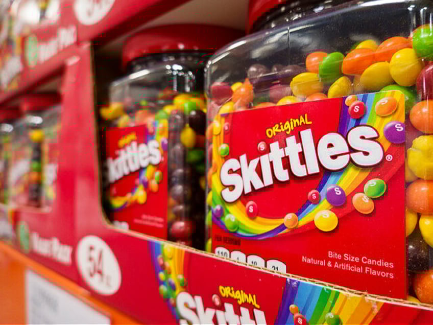 SAN DIEGO, CALIFORNIA - APRIL 27: Packages of Skittles candy are displayed at a Costco Who