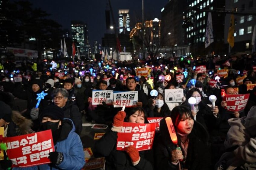 Protesters demanding President Yoon Suk Yeol's resignation demonstrate outside the Nationa