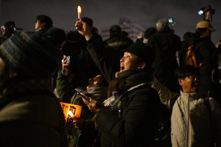 Protesters gather outside the National Assembly in Seoul after South Korea President Yoon