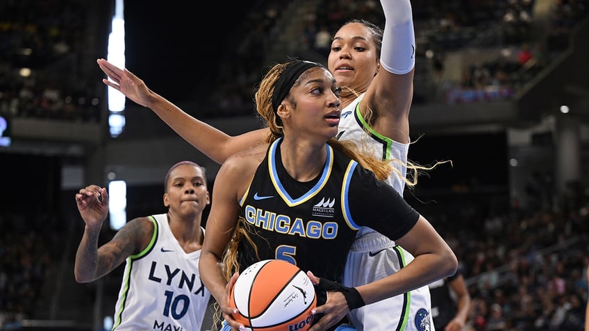 Angel Reese drives to the basket
