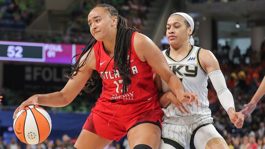 Chennedy Carter guards Haley Jones