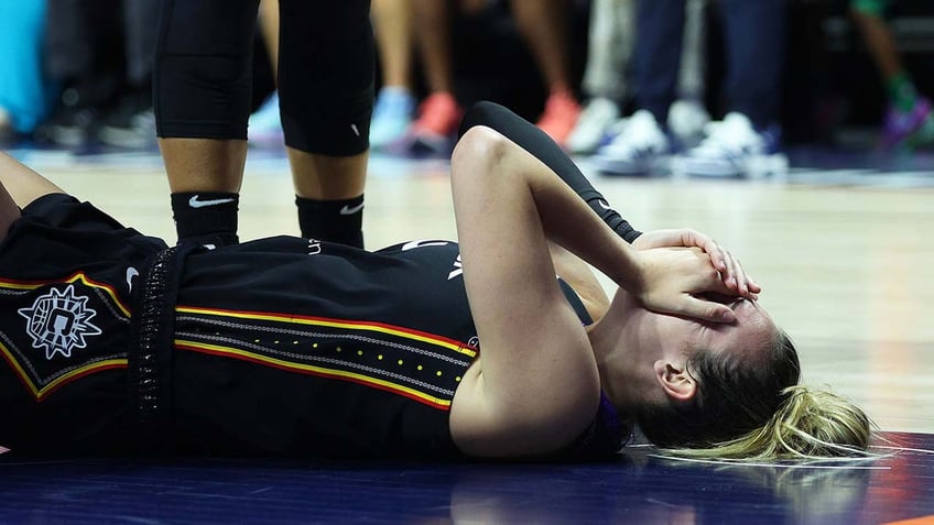 Marina Mabrey reacts during a WNBA game