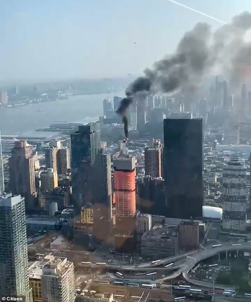 skyscraper crane in manhattan bursts into flames collapses onto street