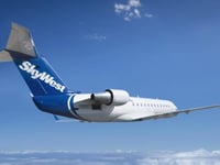 SkyWest flight diverted after passenger tries to open emergency door, fights with flight attendant: report