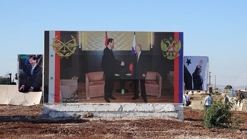 bashar assad and vladimir putin on a poster