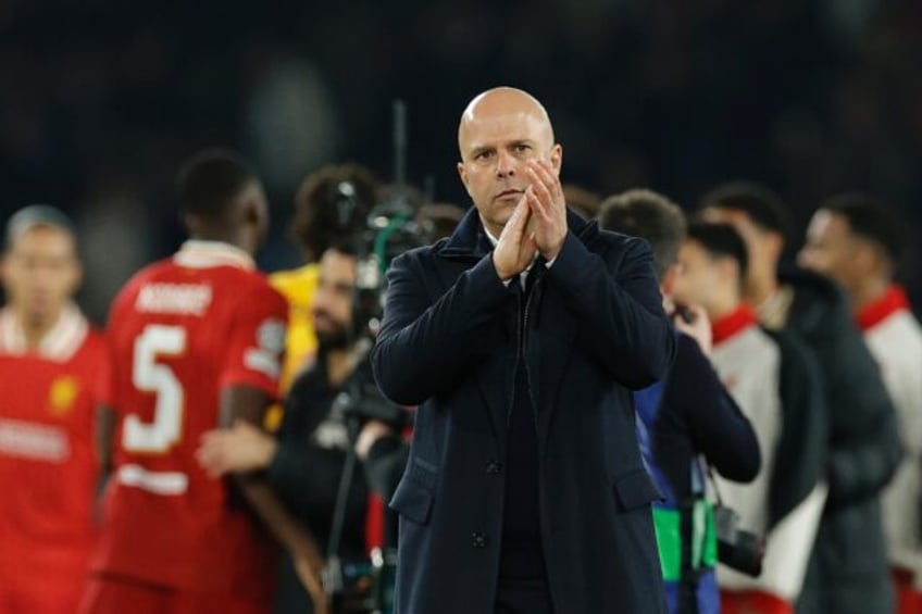 Liverpool coach Arne Slot acknowledges his team's supporters at the end of their 1-0 win o