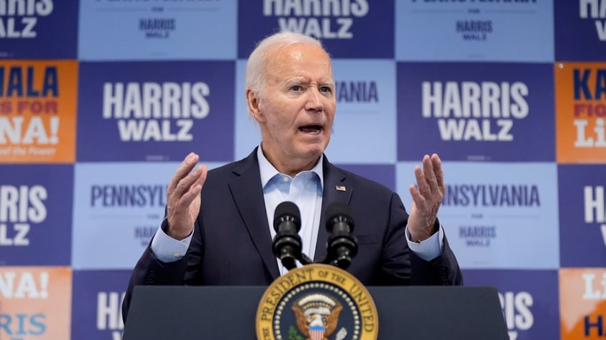 closeup shot of Biden at podium gesturing with arms