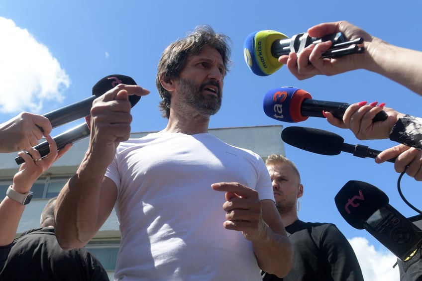 Slovak Defence Minister Robert Kalinak gestures as he addresses a press conference in front of the F D Roosevelt University Hospital in Banska Bystrica, Slovakia on May 18, 2024, where Slovak Prime Minister Robert Fico is being treated after he was shot "multiple times" on May 15. Slovakia's health minister said on May 18 the prognosis for the Slovak Prime Minister Robert Fico's health condition after Wednesday's assassination attempt was "positive". The suspect charged with the attempted murder of the Slovak Prime Minister arrived on May 18 in a court that will decide on pre-trial detention. Fico was hospitalised after the shooting on Wednesday, May 15, which happened as the 59-year-old leader was speaking to members of the public after a meeting in the central town of Handlova. (Photo by Ferenc ISZA / AFP) (Photo by FERENC ISZA/AFP via Getty Images)