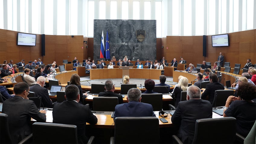 Slovenian Prime Minister Robert Golob speaks before parliament