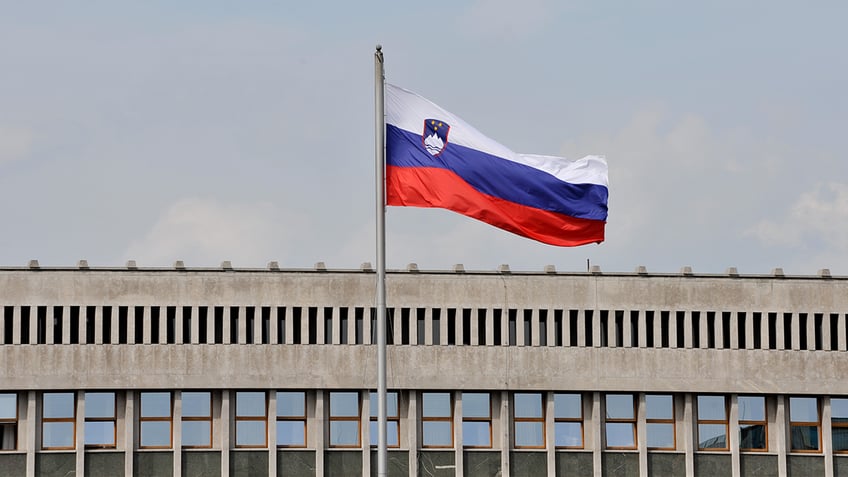 Slovenian flag in front of parliament.