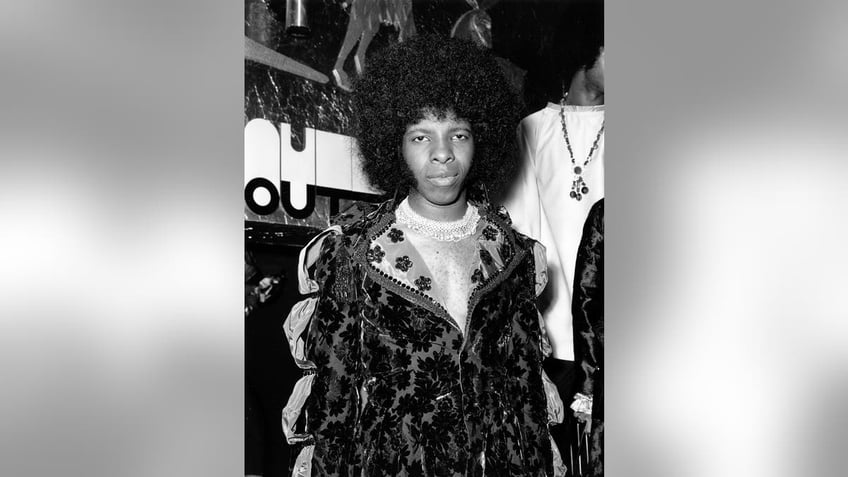 A close-up of Sly Stone in costume getting ready to perform.