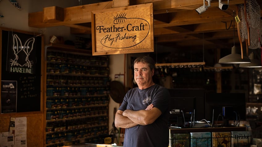 Bob Story stands inside his business, Feather-Craft Fly Fishing