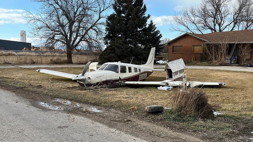 Piper Saratoga in yard of home