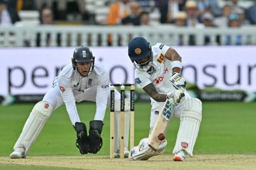 Keeping up: England's Jamie Smith behind the stumps as Sri Lanka's Pathum Nissanka bats in