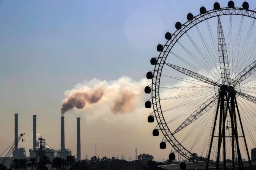 Smoke belches from the Dora power station, one of several plants that residents blame for