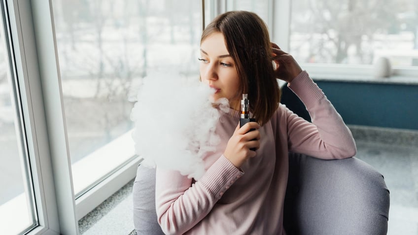 Girl smoking and vaping