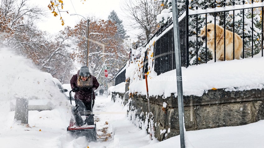 snow piles up in north dakota as regions first major snowstorm of the season moves eastward