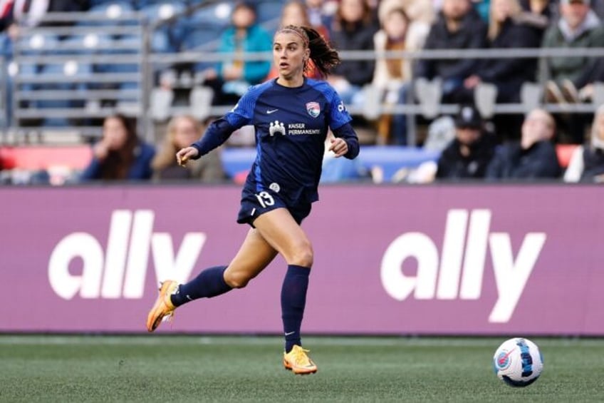 US soccer great Alex Morgan bade a farewell to football on Sunday, hanging up her boots in