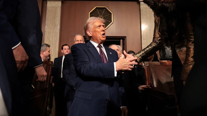 WASHINGTON, DC - MARCH 04: U.S. President Donald Trump enters the U.S. House chamber before he addresses a joint session of Congress at the U.S. Capitol on March 04, 2025 in Washington, DC.     Win McNamee/Pool via REUTERS