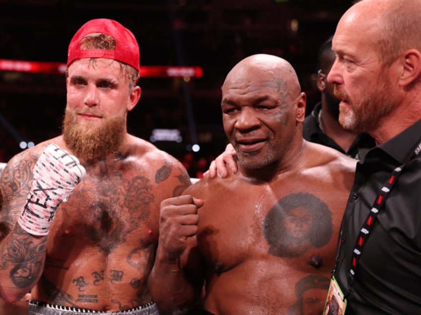 ARLINGTON, TEXAS - NOVEMBER 15: (L-R) Jake Paul announced as winner against Mike Tyson during LIVE On Netflix: Jake Paul vs. Mike Tyson at AT&T Stadium on November 15, 2024 in Arlington, Texas. (Photo by Al Bello/Getty Images for Netflix © 2024)