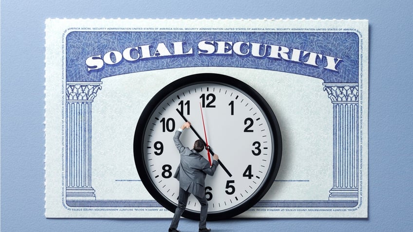 A man holds back the hands of time on a large clock that stands in front of a large Social Security card.