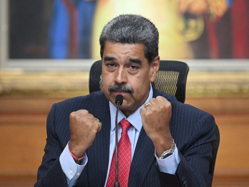 Venezuelan President Nicolas Maduro gestures during a press conference to the internationa