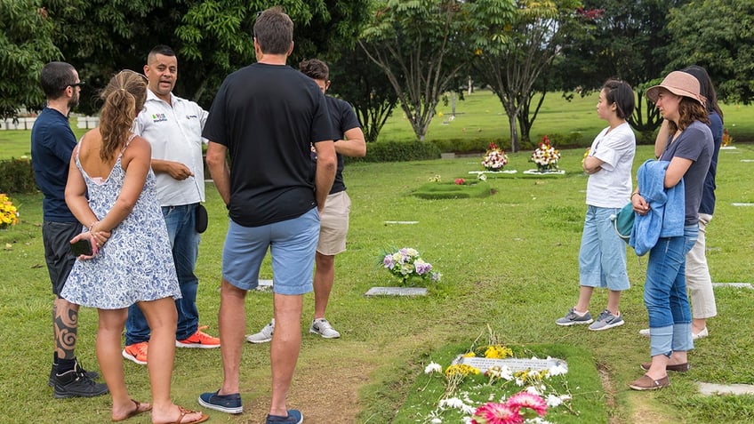 People standing around Griselda Blancos gravesite