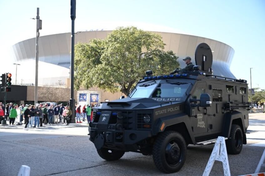 Members of a Louisiana State Police SWAT team stand guard outside of the Superdome ahead o