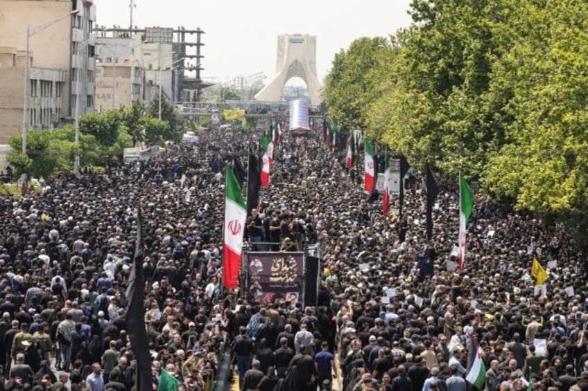 Mourners throng the streets of Tehran for the funeral