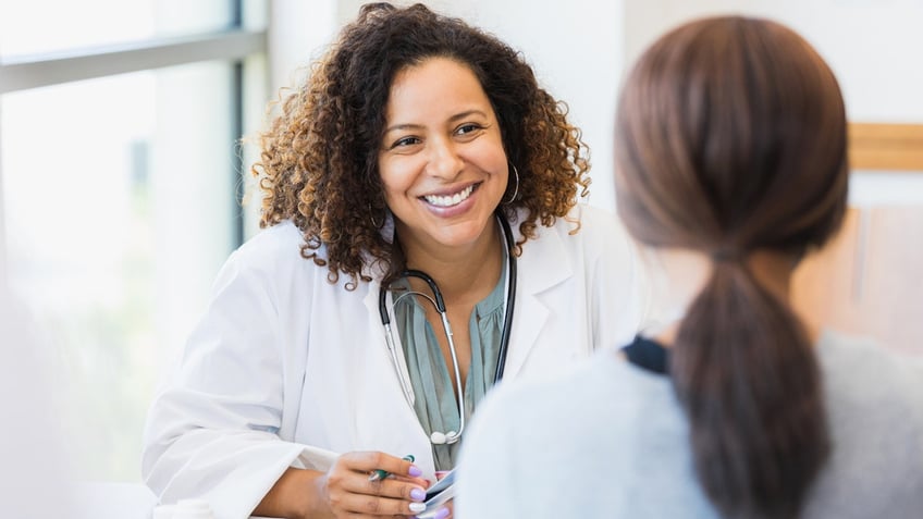 doctor listens to patient