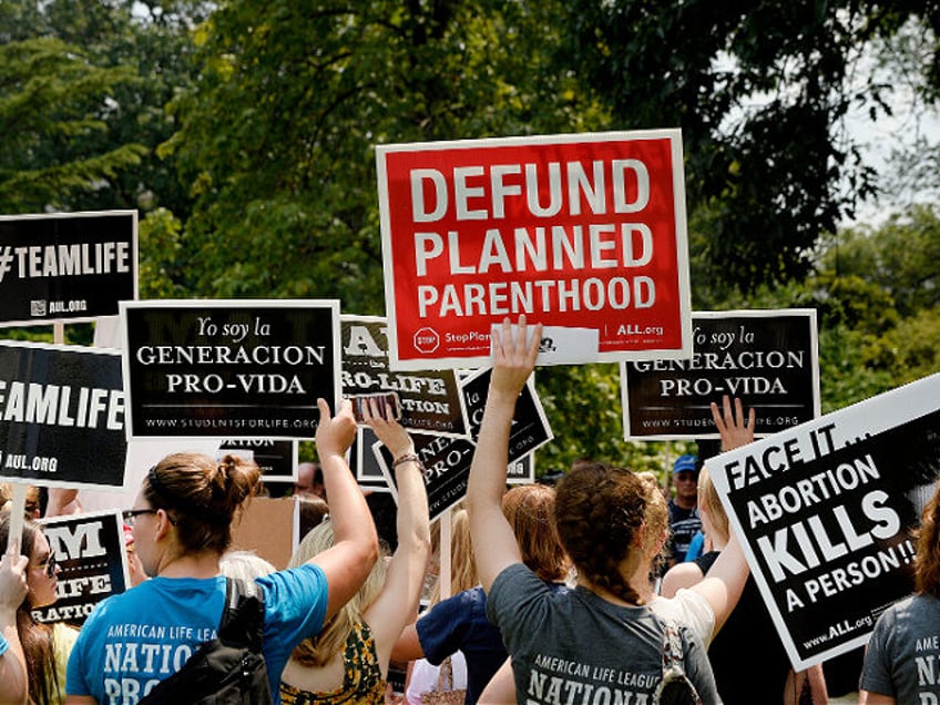 WASHINGTON, DC - JULY 28: Anti-abortion activists hold a rally opposing federal funding fo