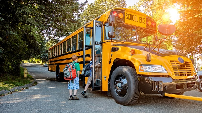 boy boards school bus