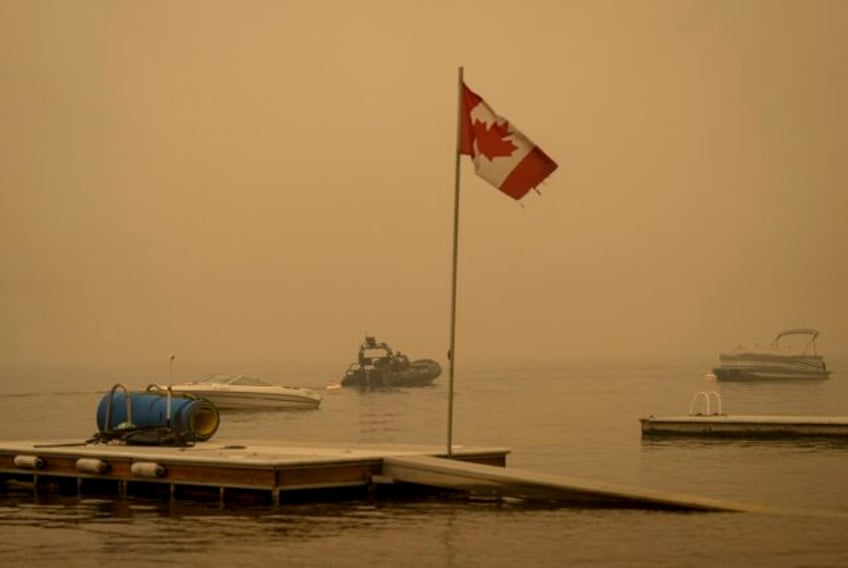 some wildfire evacuations end in british columbia but fire threatens community farther north