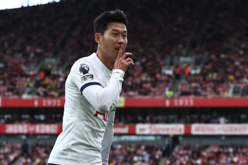 son double holds arsenal liverpool cut man citys premier league lead