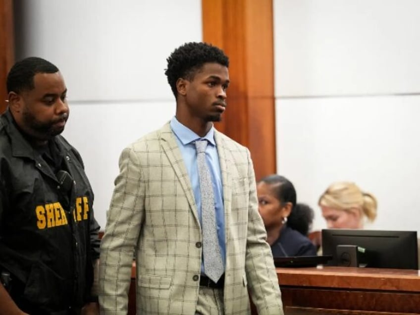 son of murdered nfl player convicted in slaying wife flees courtroom in tears