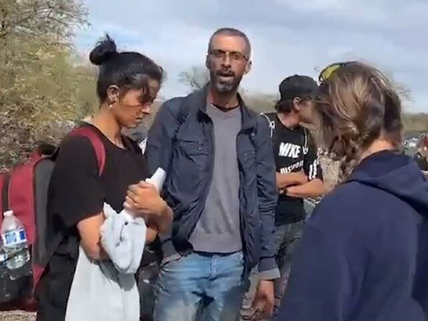 An African migrant tells a journalist, "Soon you're gonna know who I am." (1stResponderMedia X Video Screenshot)