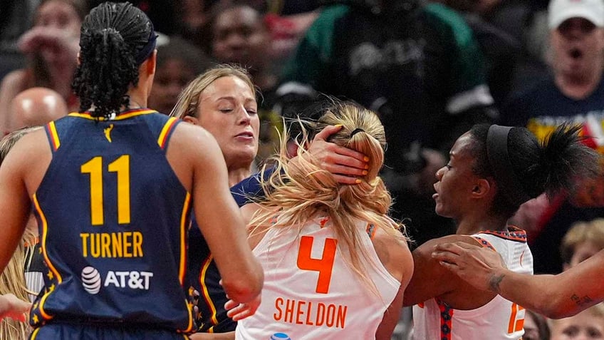 Sophie Cunningham and Jacy Sheldon scuffle on the court