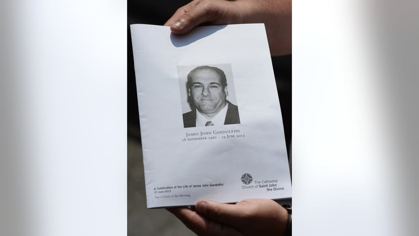 A program with a photo of James Gandolfini