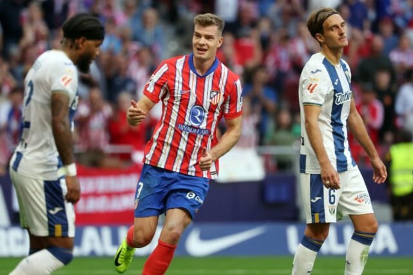 Atletico Madrid's Norwegian forward Alexander Sorloth (C) celebrates scoring his first goa