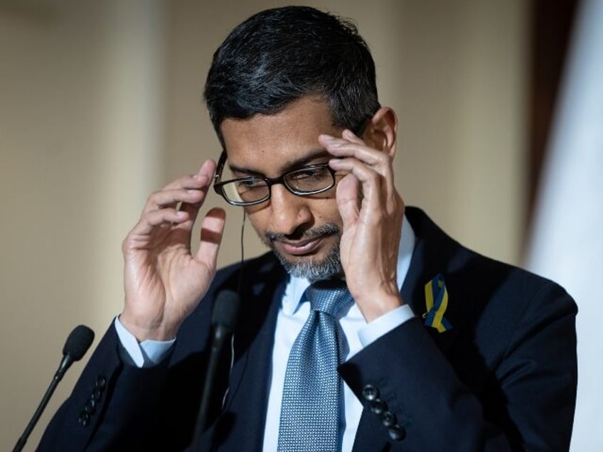 Google CEO Sundar Pichai looking down