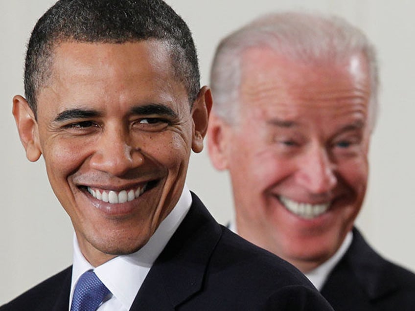 President Barack Obama and Vice President Joe Biden smile in the East Room of the White Ho