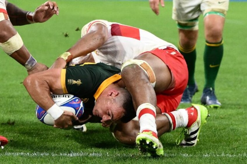 south africa beat tonga 49 18 to edge towards world cup quarters