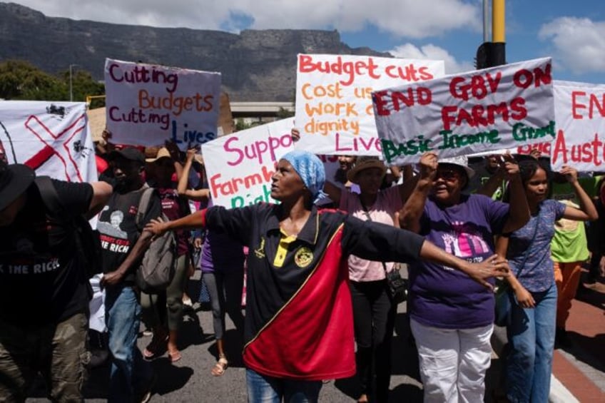 Hundreds of people protested outside the South African parliament as the ANC government un