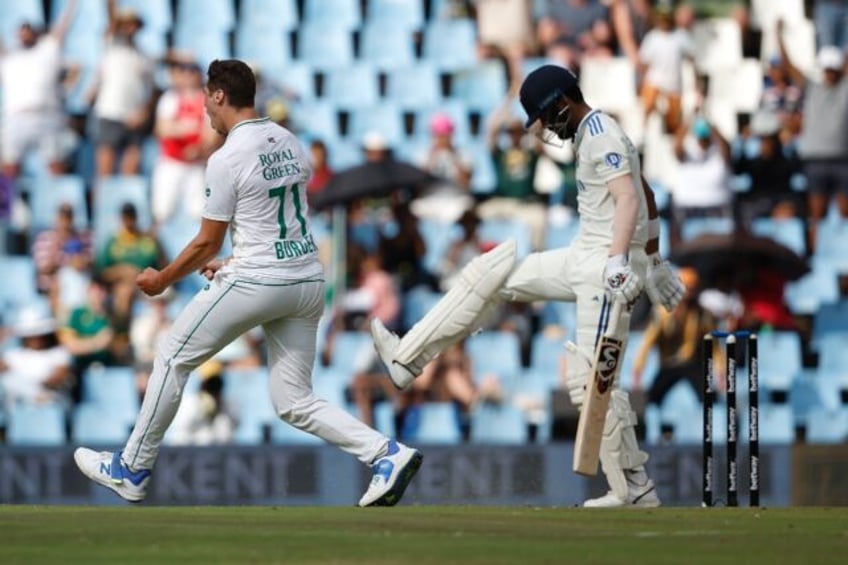 Nandre Burger (L) removes KL Rahul (R) as South Africa skittled India for 131 to win the first Test in Centurion