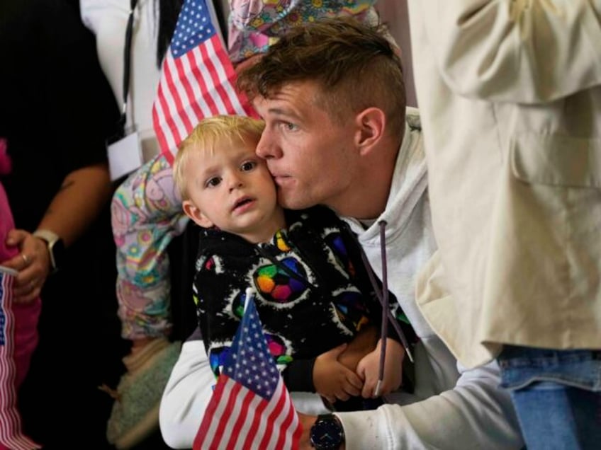 Afrikaner refugees from South Africa arrive, Monday, May 12, 2025, at Dulles International