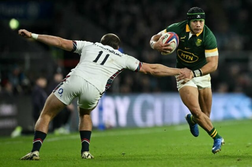 Show and go: South Africa wing Cheslin Kolbe (R) side-steps Ollie Sleightholme to score th