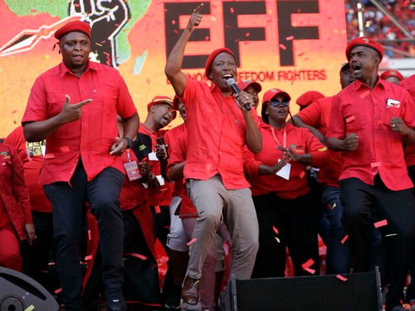 FILE - Leader of the Economic Freedom Fighters (EFF) party, Julius Malema, centre, with pa