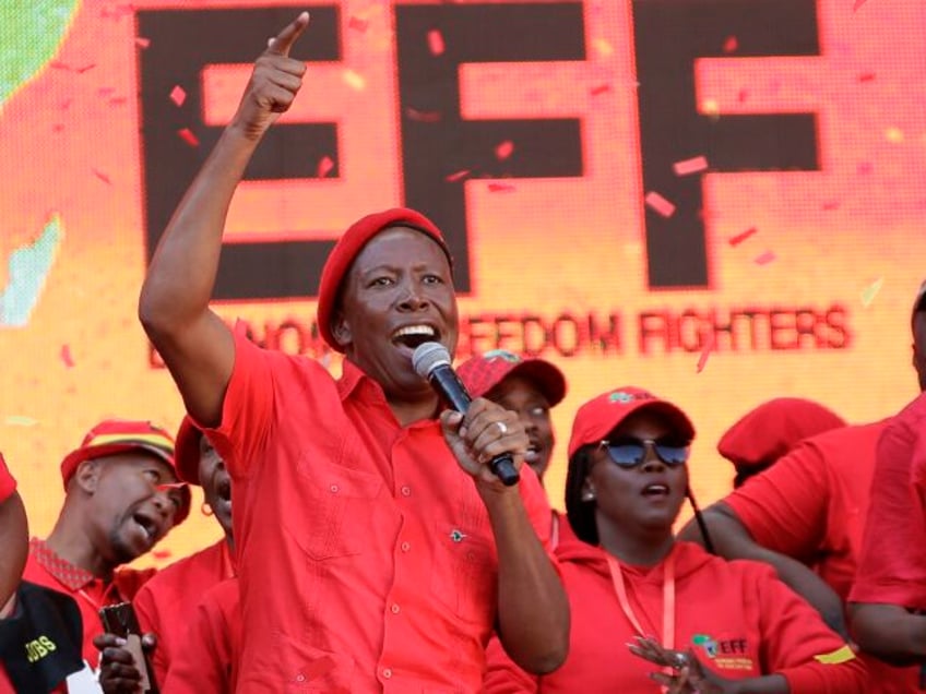 FILE - Leader of the Economic Freedom Fighters (EFF) party, Julius Malema, centre, with pa